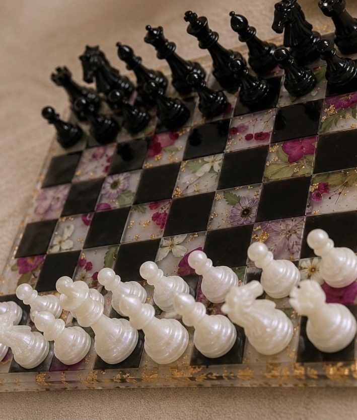 Black and floral resin chessboard close view